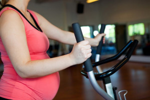 effects-of-exercise-during-pregnancy-pregnant-woman-exercise-bike-wellness | American Pregnancy Association